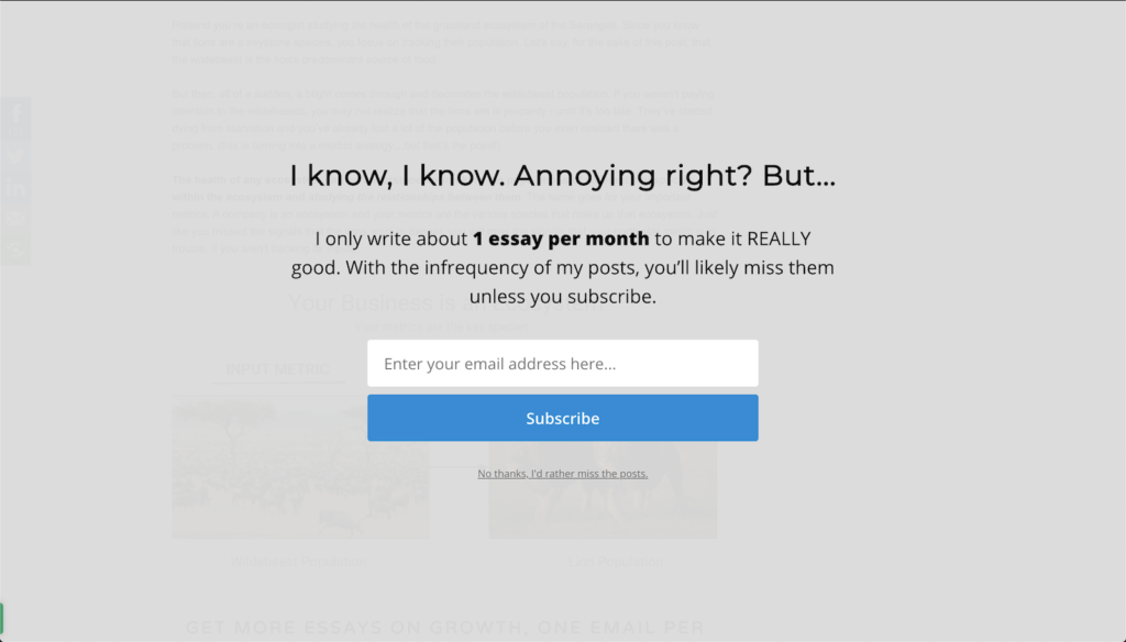 Full screen content blocker asking visitors to subscribe, noting one essay per month