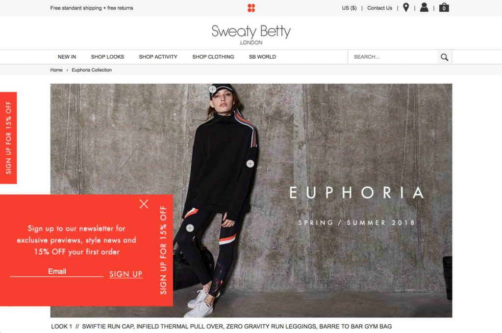 Sweaty Betty site with side tab and pop-up offering 15% off for newsletter signup