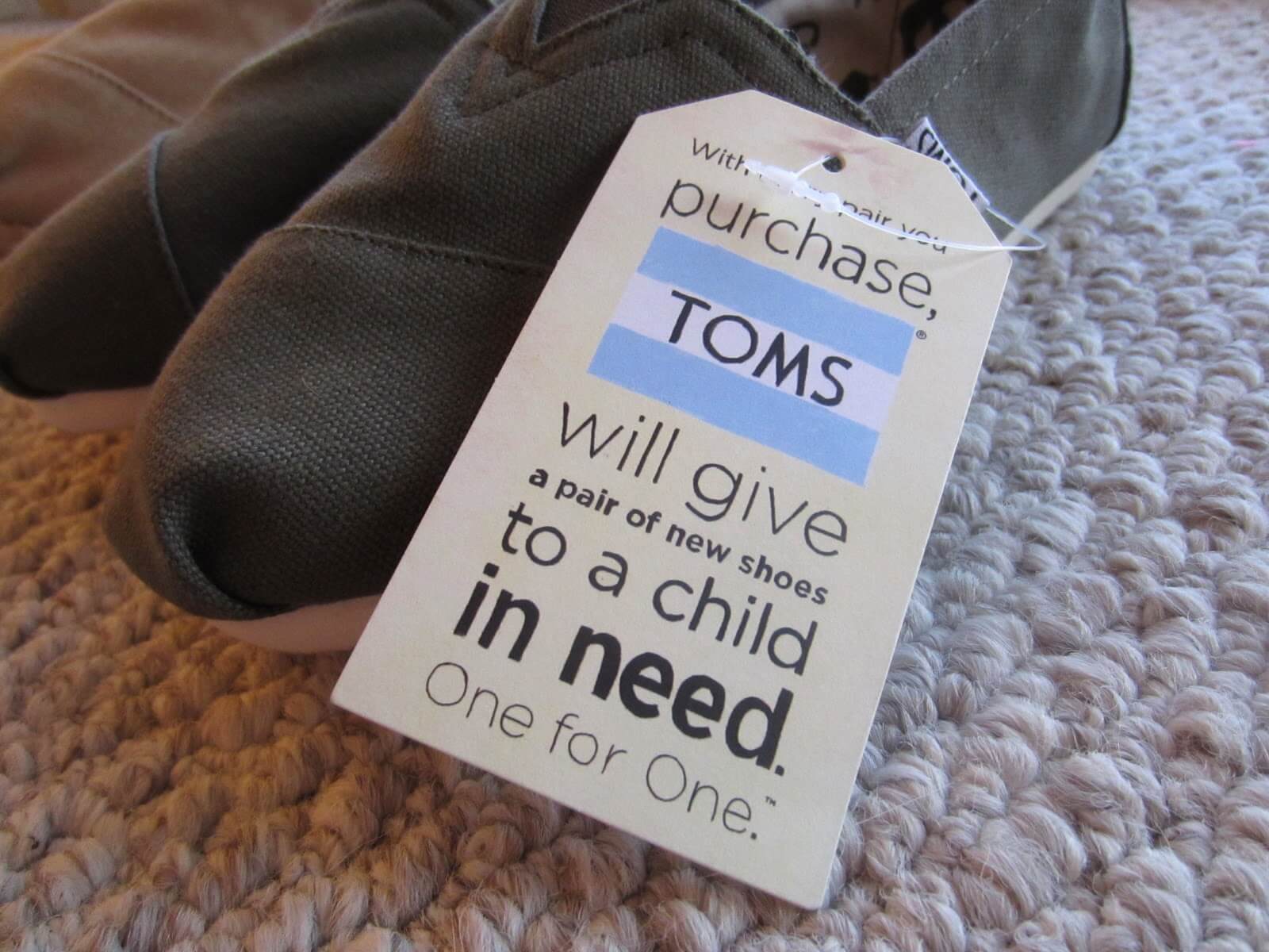 TOMS One for One tag on a pair of shoes