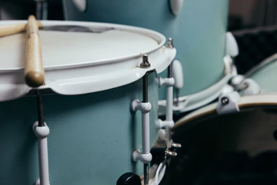 Close up of a snare drum with drumsticks