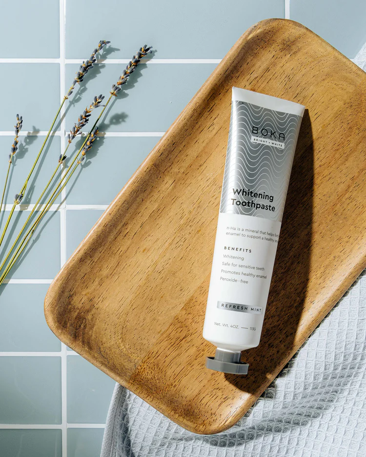 Boka whitening toothpaste on a wooden tray
