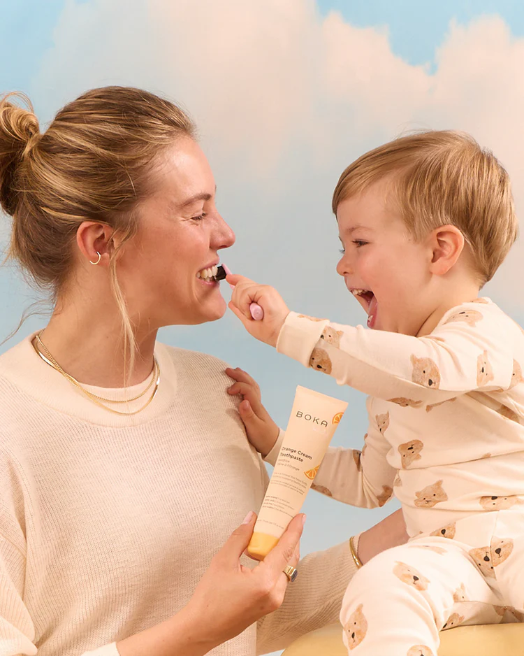 Mother and child brushing teeth with Boka kids toothpaste