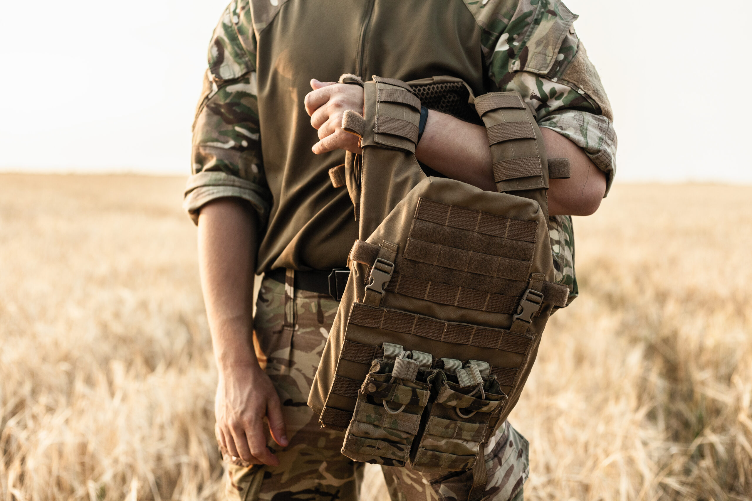 Soldier in a camo bulletproof vest from Bulletproof Zone