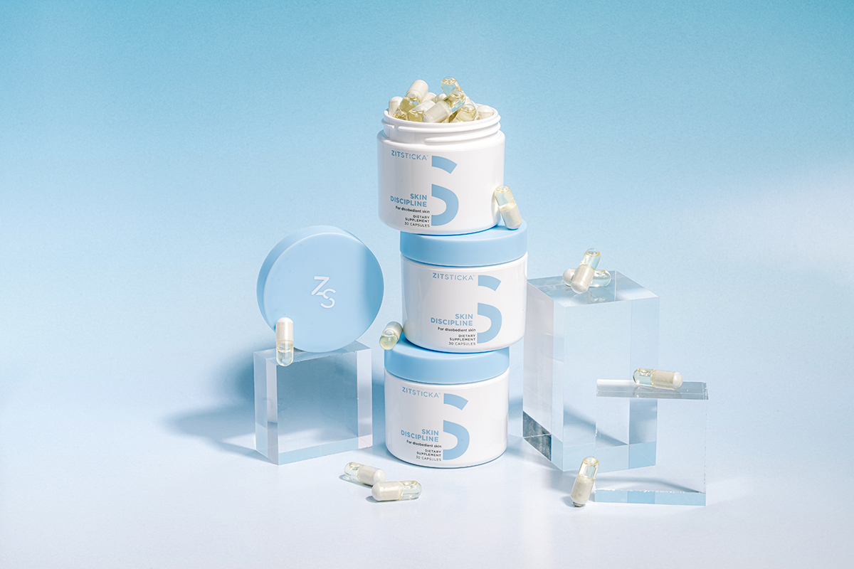 ZitSticka supplement jars stacked on a blue background
