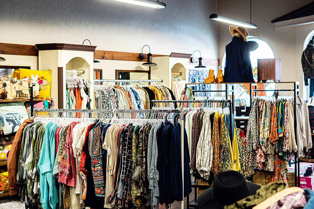 Clothing racks inside the Grace and Grit Boutique store