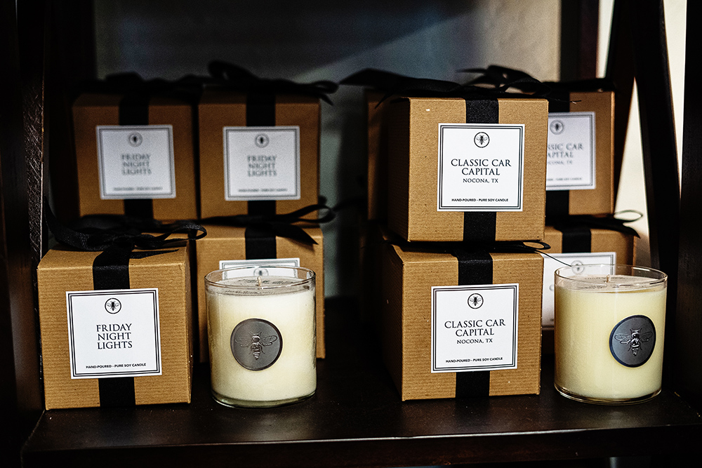 Candles on a shelf at Grace and Grit Boutique