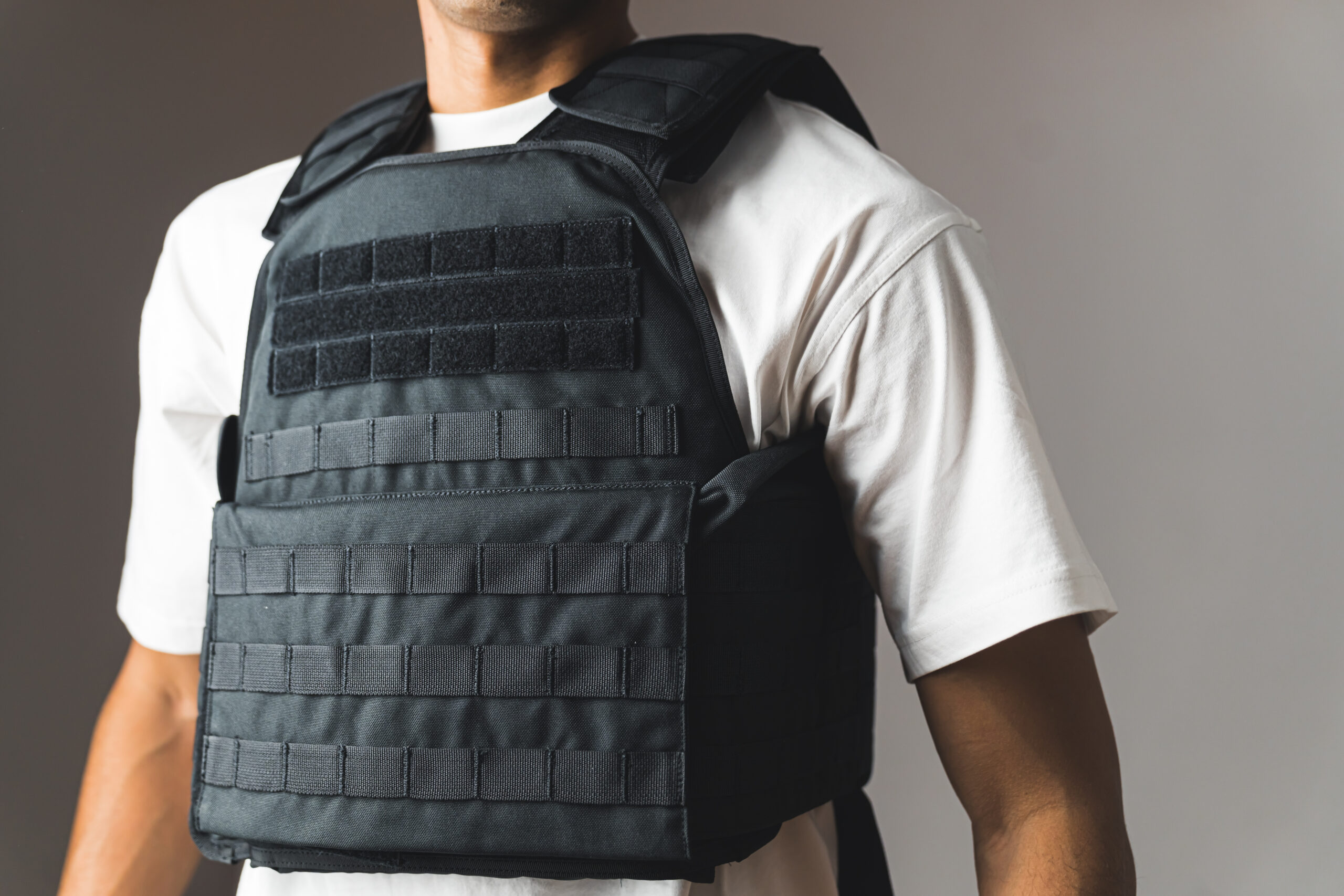 Man wearing a black bulletproof vest