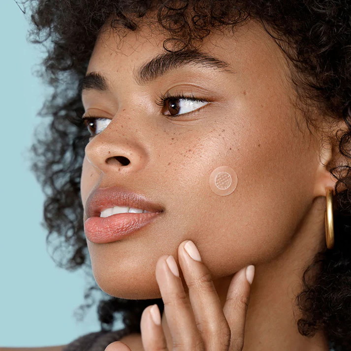 Woman wearing a ZitSticka pimple patch on her cheek