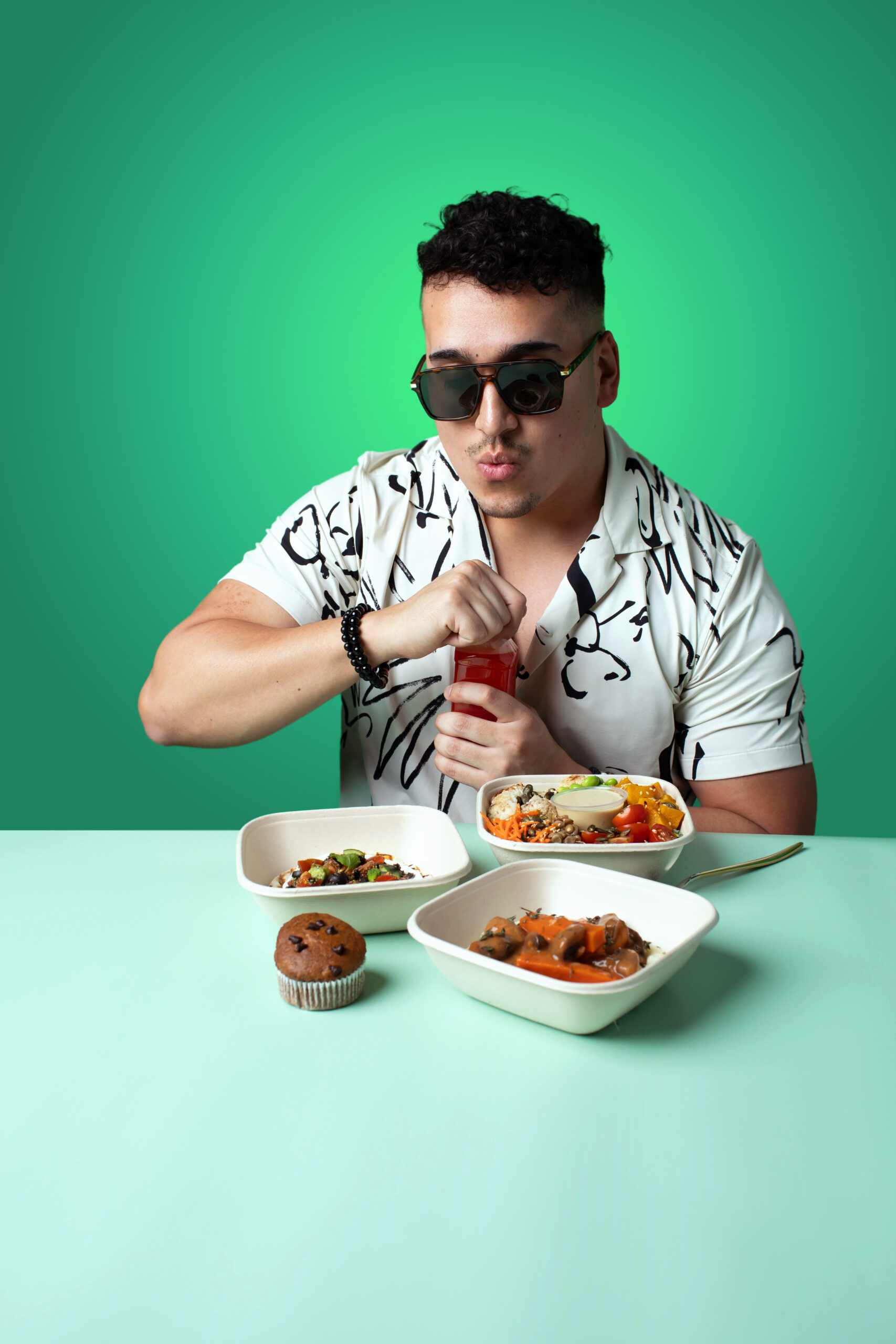 Man with Fitlab meal boxes and juice