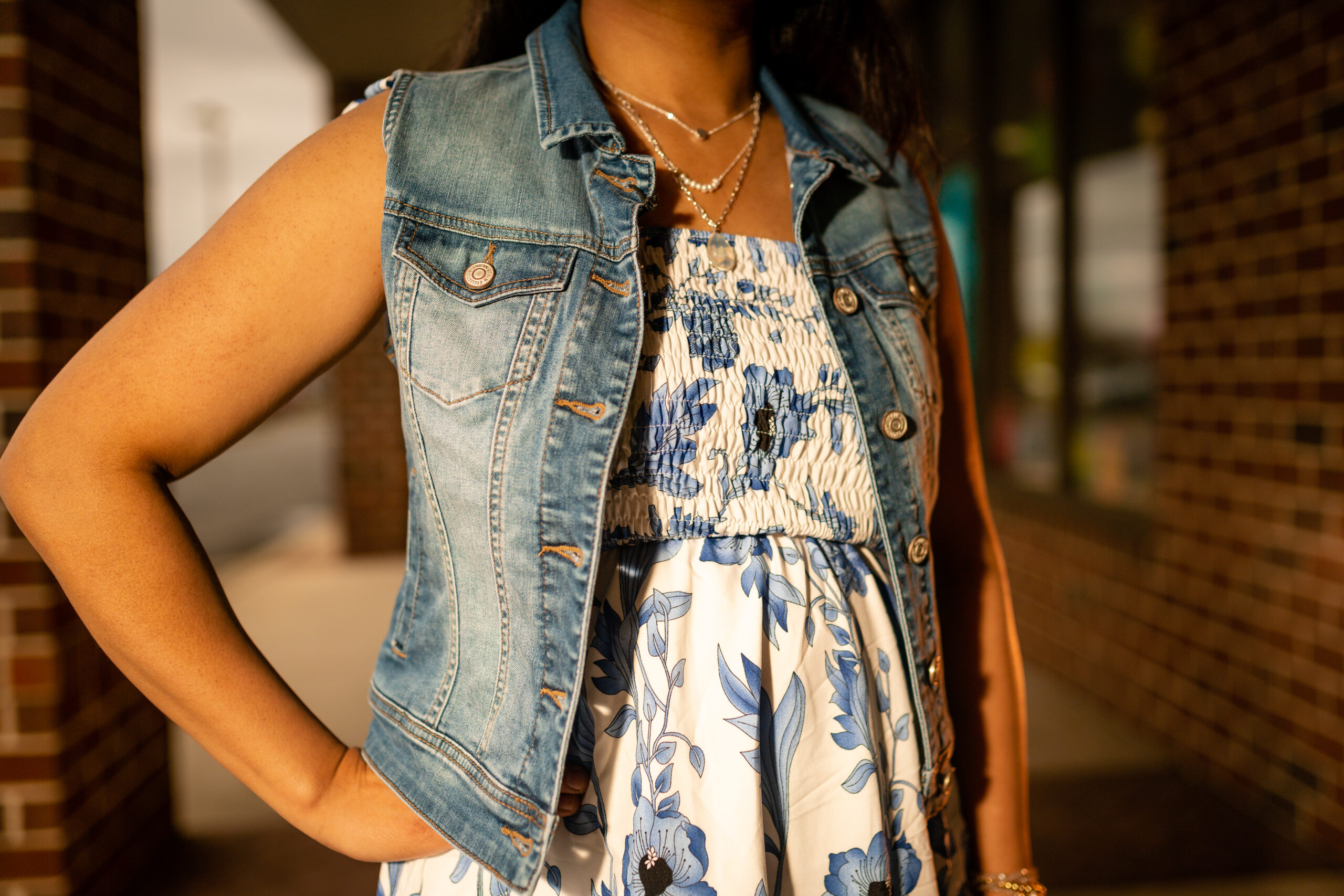 Denim vest over a floral top from Sybaritic Boutique