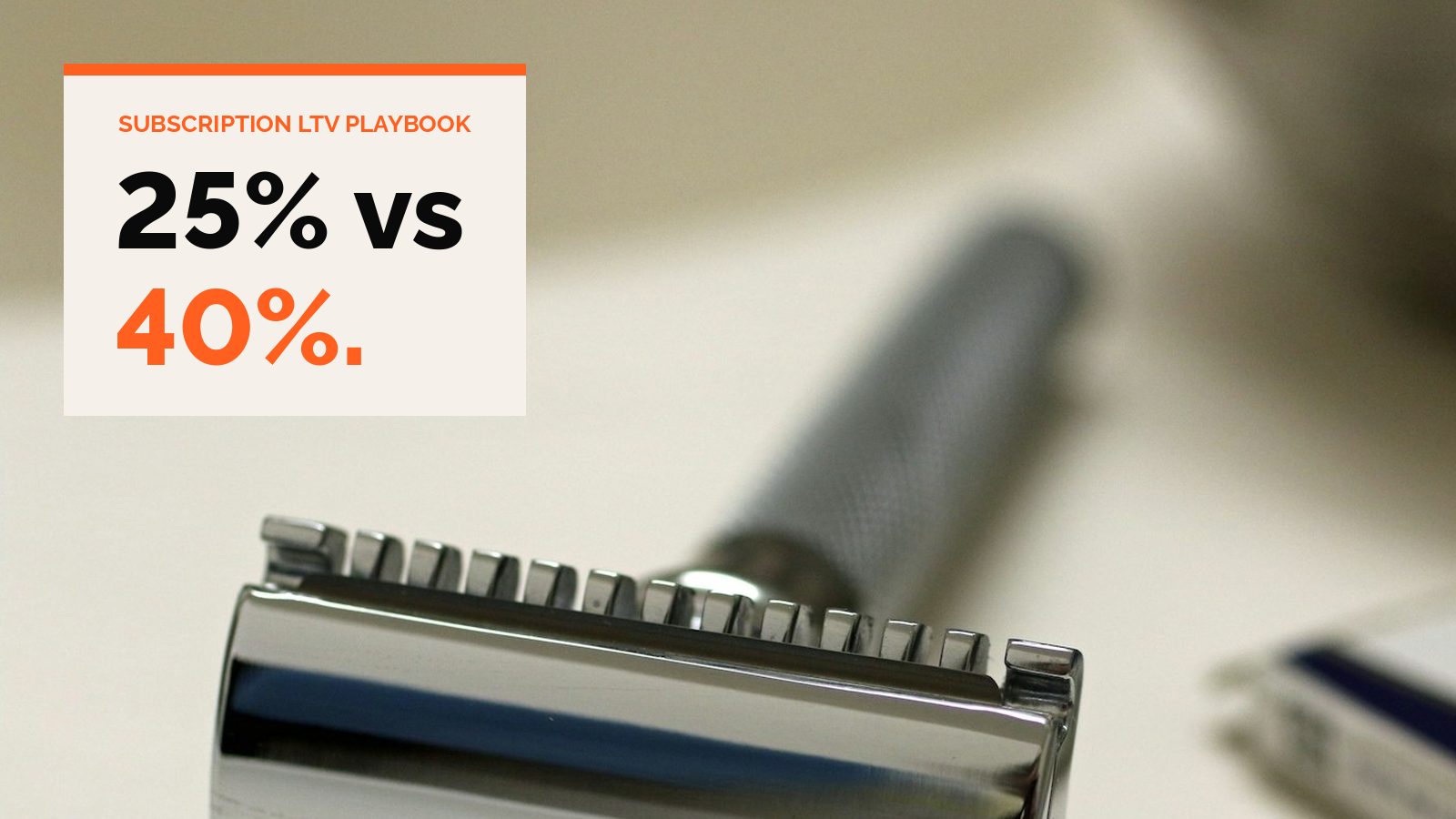A chrome safety razor head on a white bathroom counter
