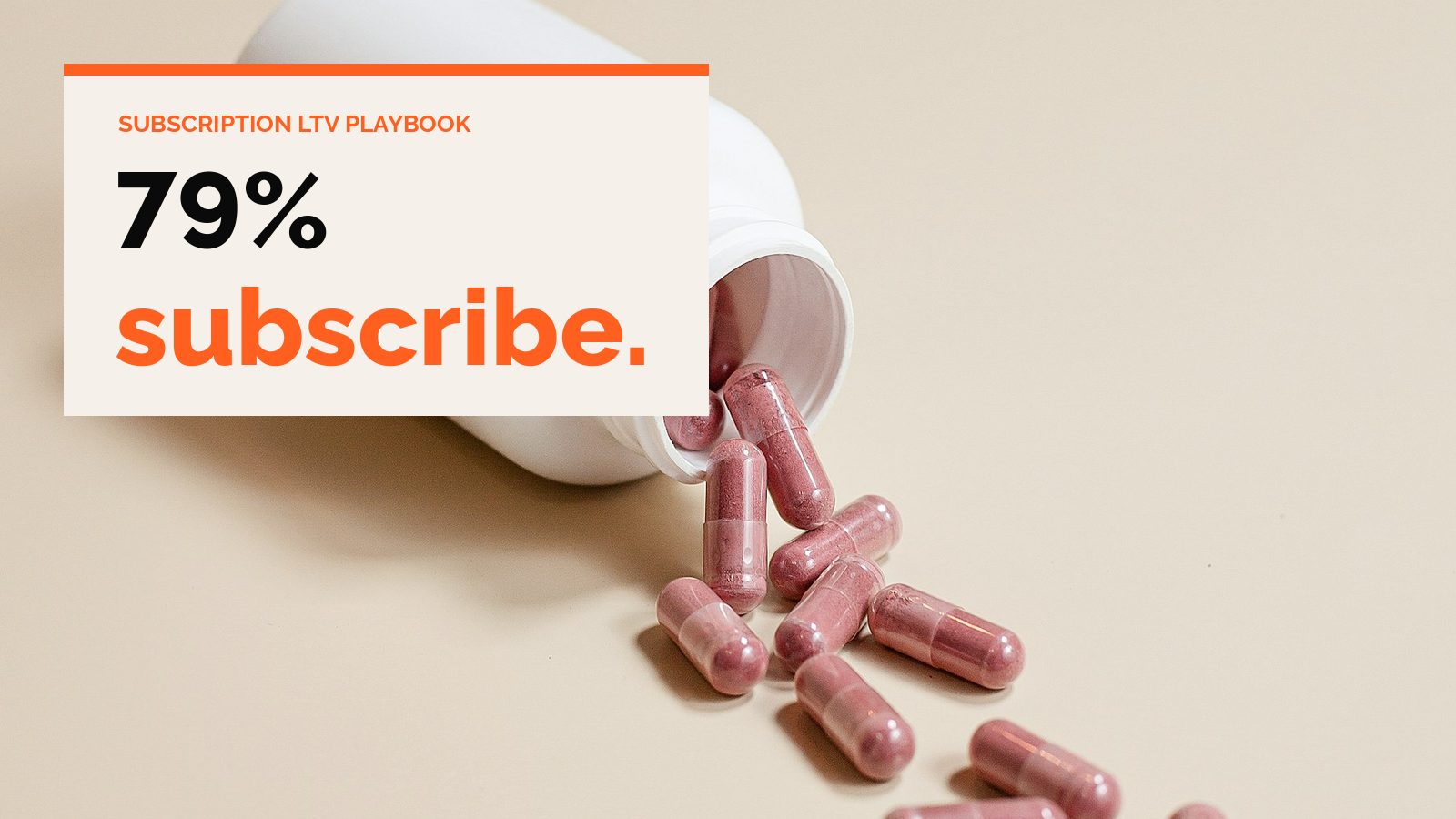 A white supplement bottle spilling pink capsules