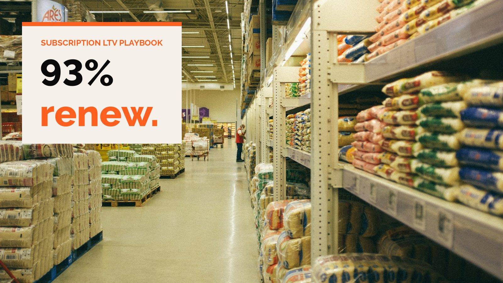 A warehouse store aisle stacked high with bulk bags of rice and grain