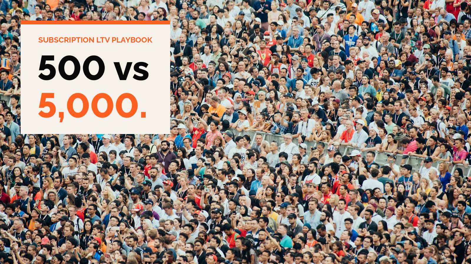A dense crowd of thousands of people standing at an outdoor event
